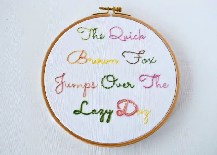 Hand embroidery lettering sampler framed in the hoop image