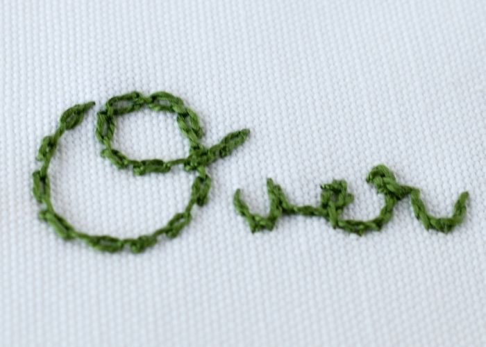 Over - hand stitched script letters with Cable chain stitch and stem stitch image