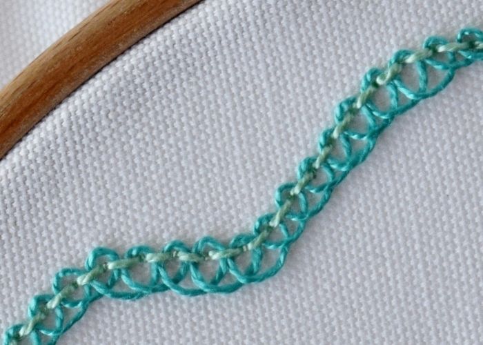 Pekinese Stitch embroidery with green pearl cotton image