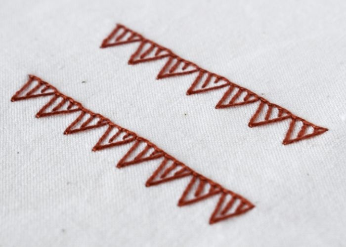 Blanket Stitch Triangles hand embroidery sampler with red pearl cotton image