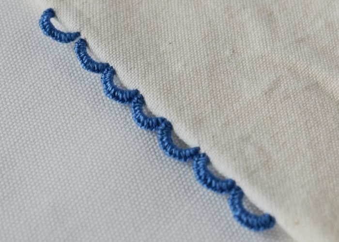 Buttonhole Bar Picots sampler stitched with blue pearl cotton thread image