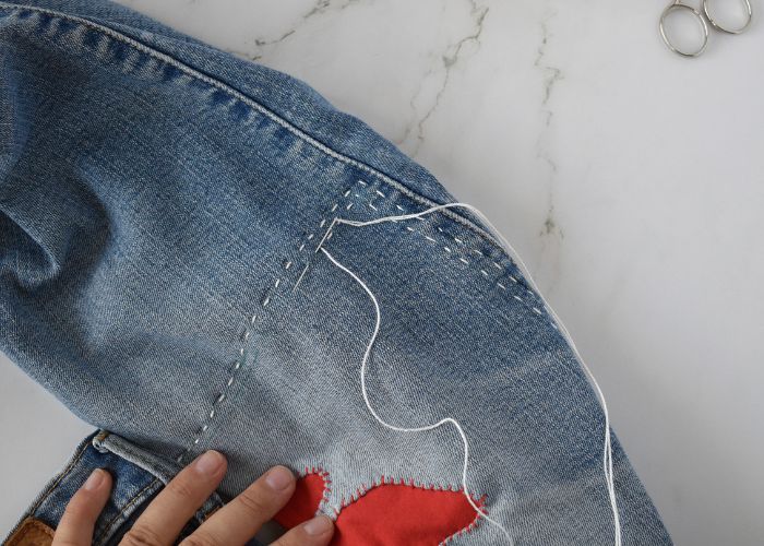 Sashiko Style Mending tutorial - sew a running stitch around the patch edge - image