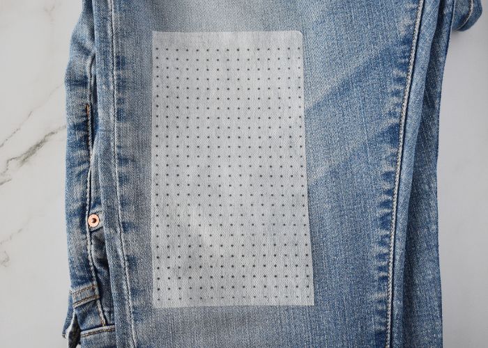 Sashiko Style Mending tutorial - sashiko embroidery on thinned fabric - image