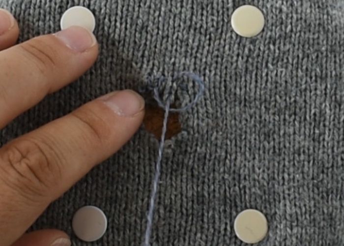 Blanket stitch mending sweater tutorial step 2 image