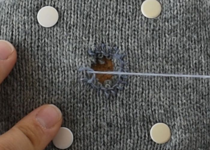 Blanket stitch mending sweater tutorial step 3 image