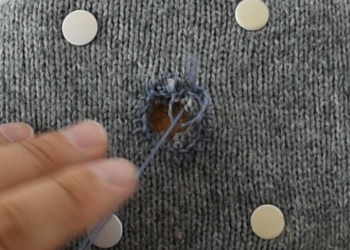 Blanket stitch mending sweater tutorial step 4 image