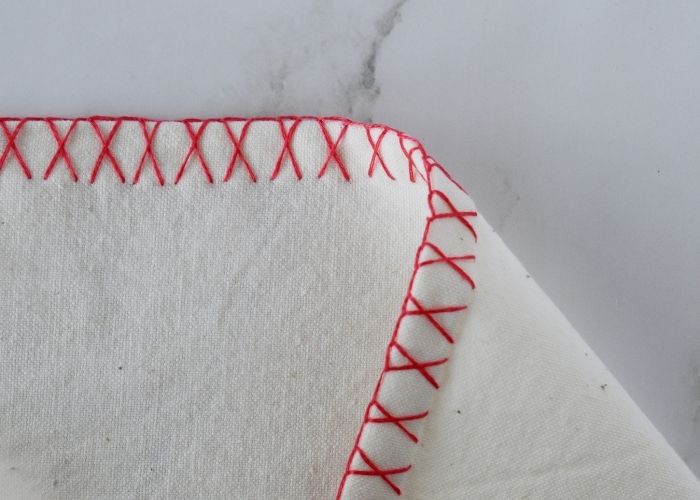 Crossed Blanket Stitch edging - front and reverse sides image