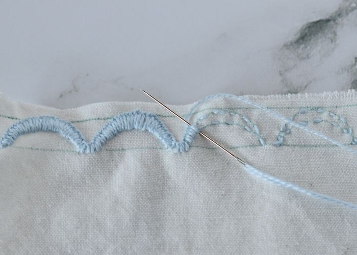 Securing a raw cut edge with Scallop Stitch embroidery image