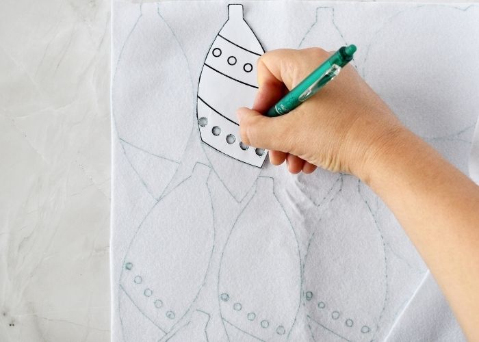 Tracing embroidery pattern on felt fabric image