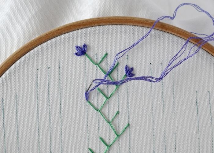 Double Feather stitch band with flowers embroidery tutorial step 2 image