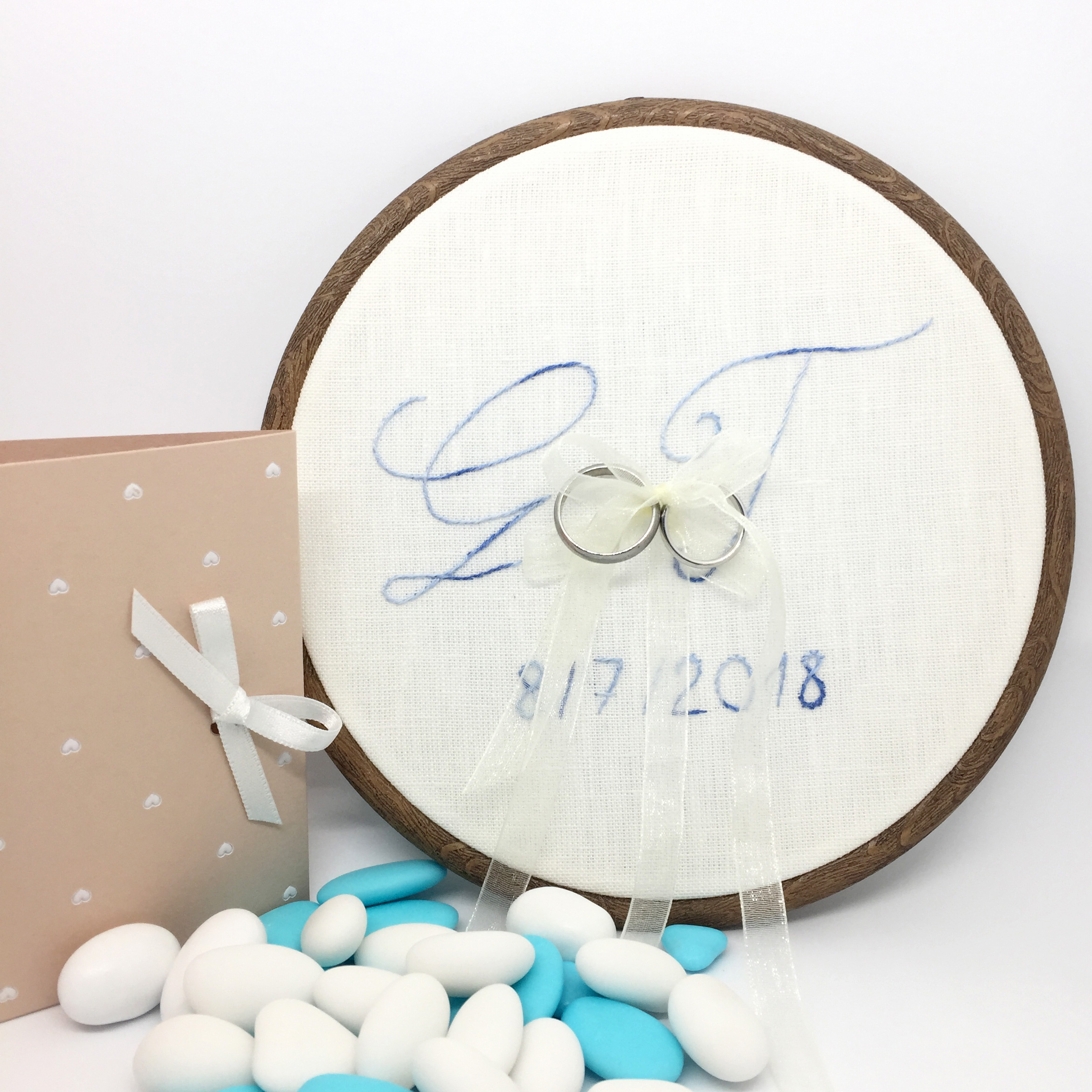 Hand embroidered initials in a hoop, holding wedding rings - image