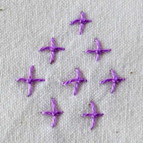 Four Legged Knot embroidery stitch made with purple pearl cotton small image