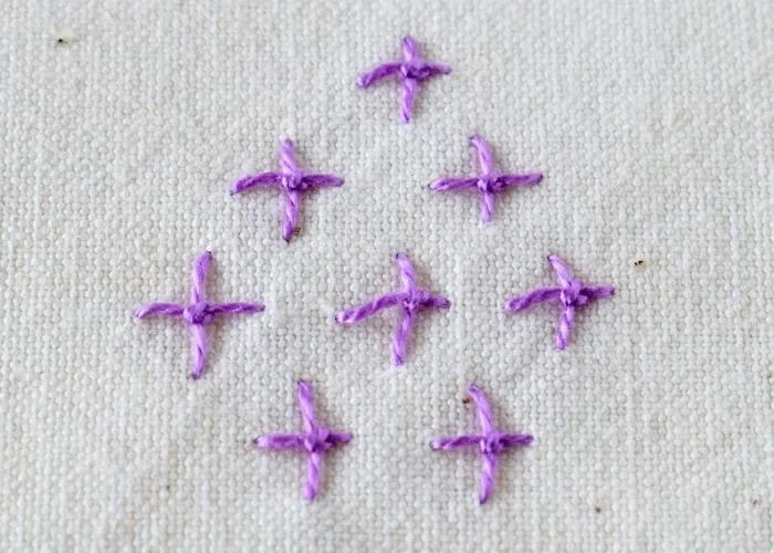 Four Legged Knot hand embroidery sampler with purple pearl cotton image