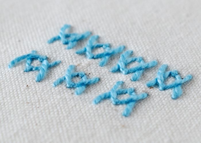 Reversed Fly Stitch hand embroidery sampler with blue pearl cotton image