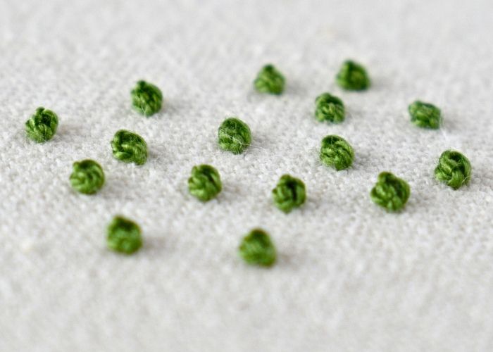 Sampler of Colonial Knot stitch embroidery with green pearl cotton thread