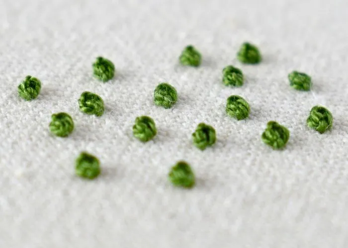 Sampler of Colonial Knot stitch embroidery with green pearl cotton thread