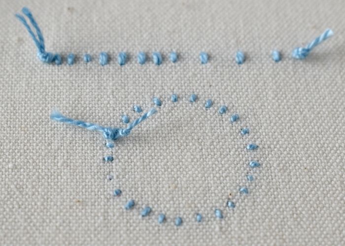 Immagine del campionario di ricamo a mano a punto perla sul retro