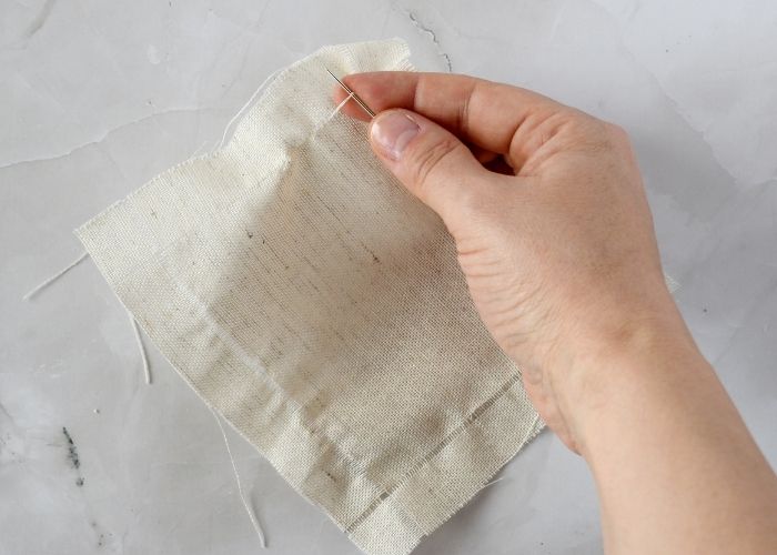 Pull the threads to create a space for the hem stitch