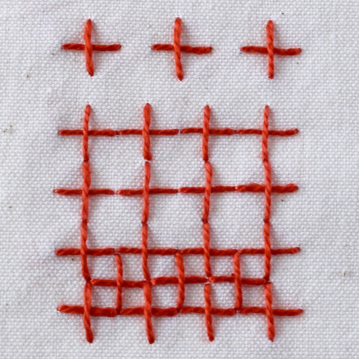 Upright Cross Stitch hand embroidery sampler with red thread image